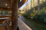 Enjoy the covered deck hanging over the river